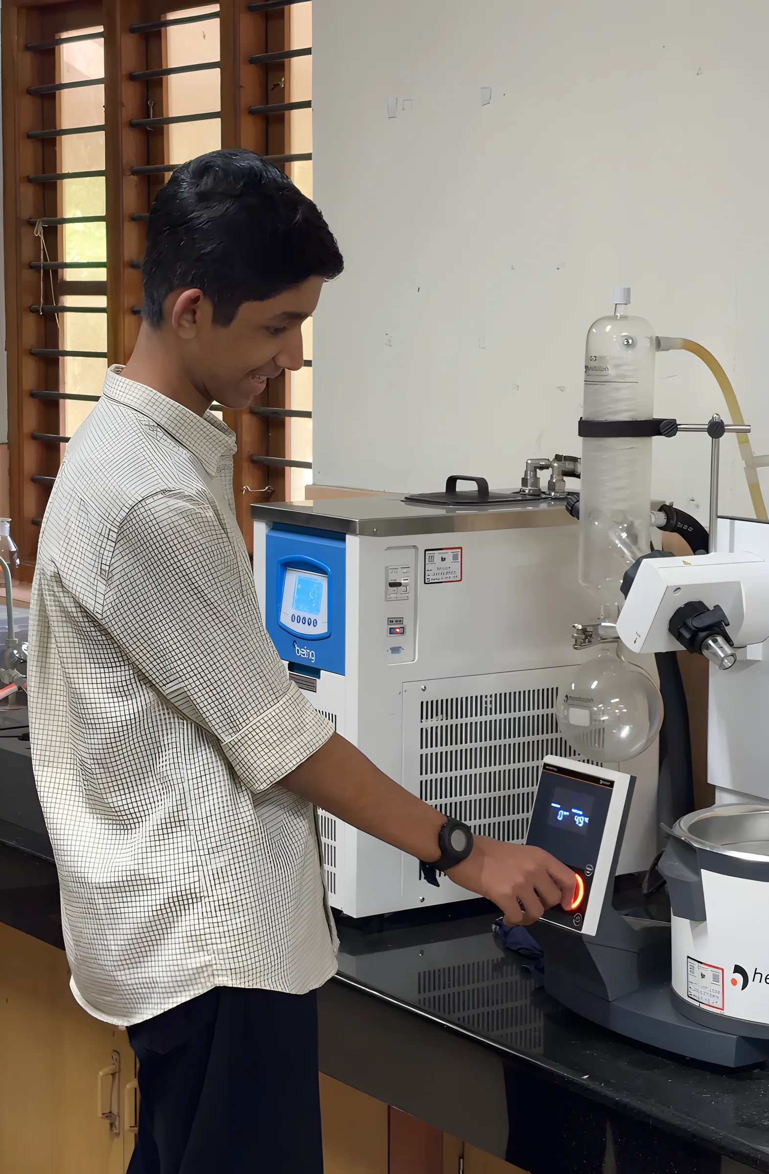 A mentor walks students through a rotary evaporator demo